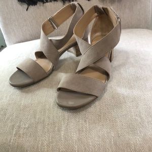 Naturalized size 6.5, tan suede, barely worn. Low, comfortable heel.